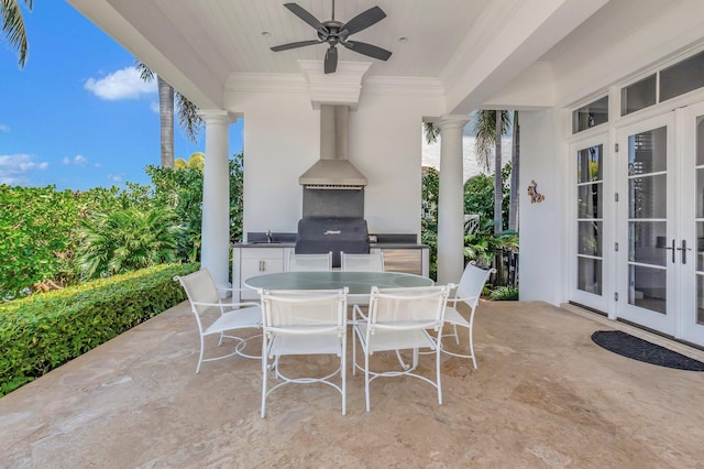 view of patio featuring a grill, an outdoor kitchen, ceiling fan, sink, and french doors