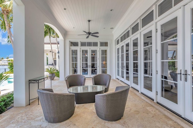 view of terrace featuring ceiling fan and french doors