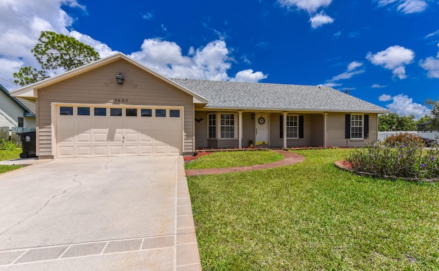 ranch-style house featuring a garage and a front lawn