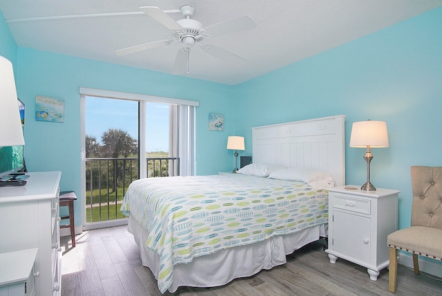 bedroom featuring wood-type flooring, ceiling fan, and access to exterior