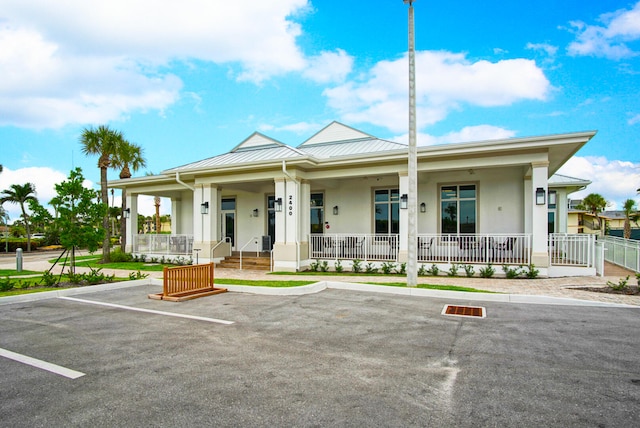 view of building exterior featuring uncovered parking