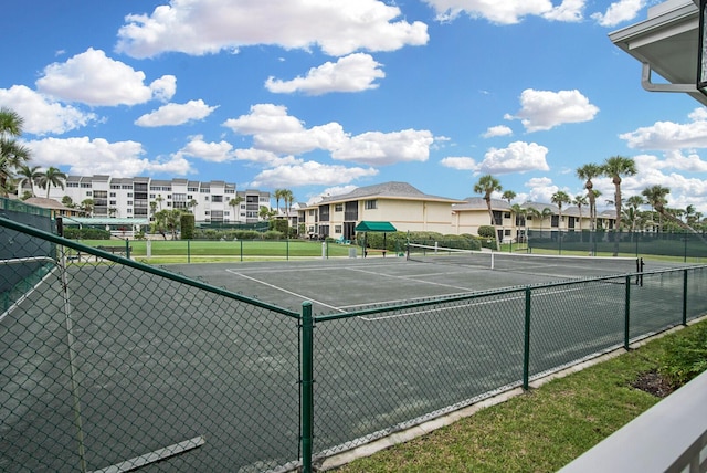 view of sport court featuring fence