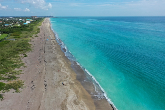 aerial view featuring a water view and a view of the beach