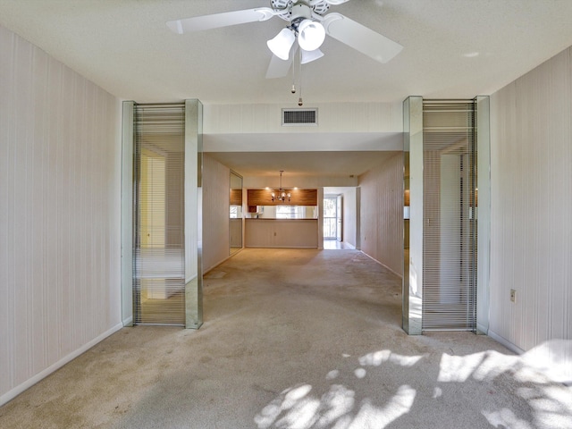 unfurnished bedroom featuring light colored carpet and ceiling fan