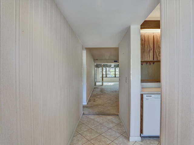 hallway featuring light carpet