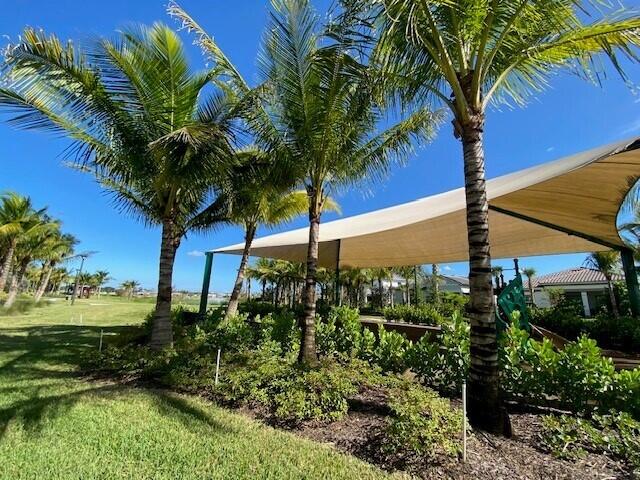 view of property's community with a lawn