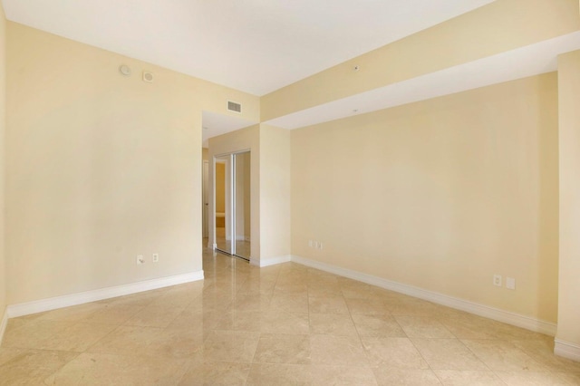 spare room featuring light tile patterned floors