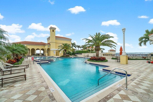 view of swimming pool with a patio area