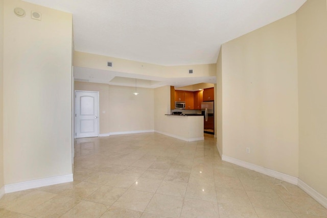 unfurnished living room with light tile patterned flooring