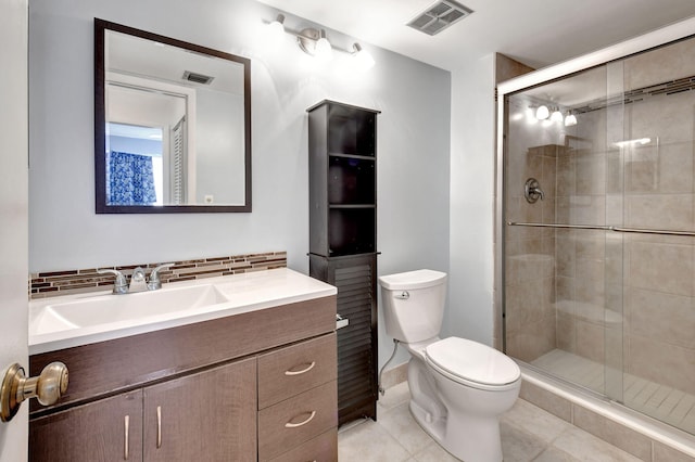 bathroom with walk in shower, toilet, tile flooring, and vanity