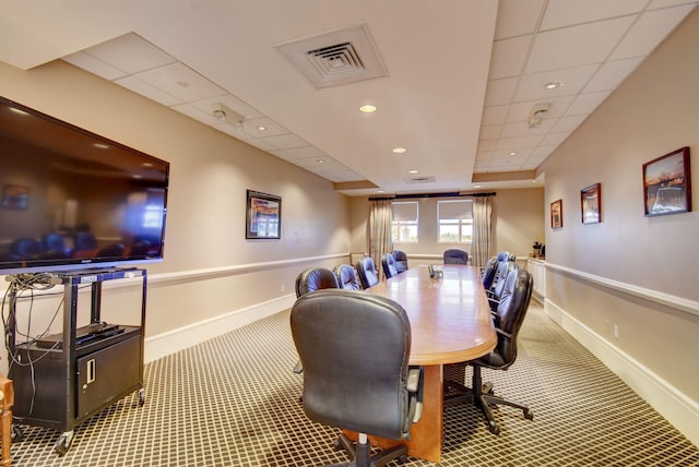 dining room with a paneled ceiling and carpet flooring