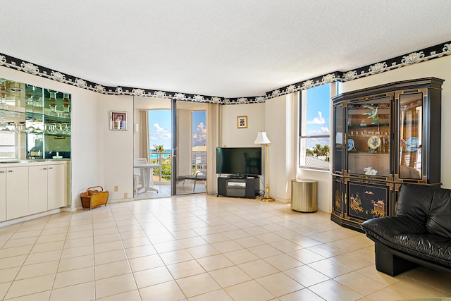 tiled living room with a textured ceiling