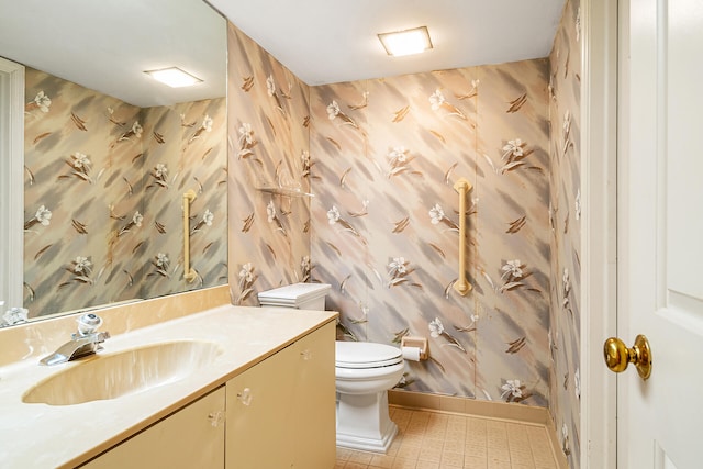 bathroom with oversized vanity, tile floors, and toilet