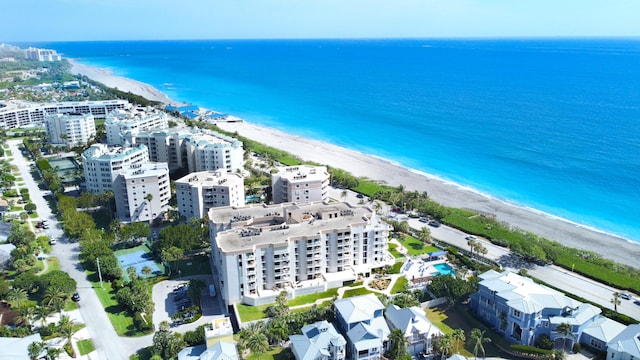 bird's eye view with a view of the beach and a water view