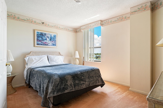 carpeted bedroom with a textured ceiling