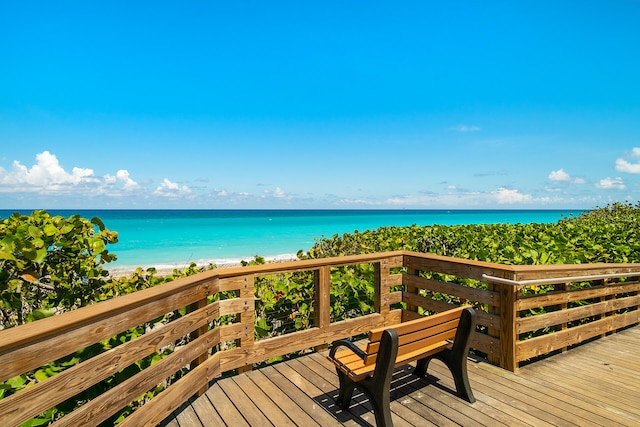 wooden deck with a water view