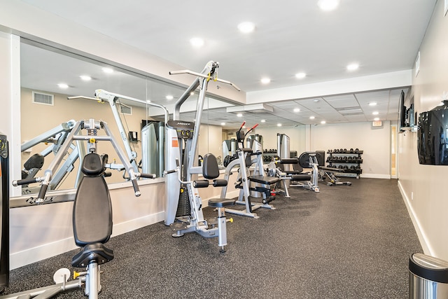 workout area featuring a drop ceiling