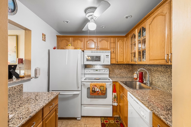 kitchen with white appliances, light tile floors, sink, tasteful backsplash, and ceiling fan