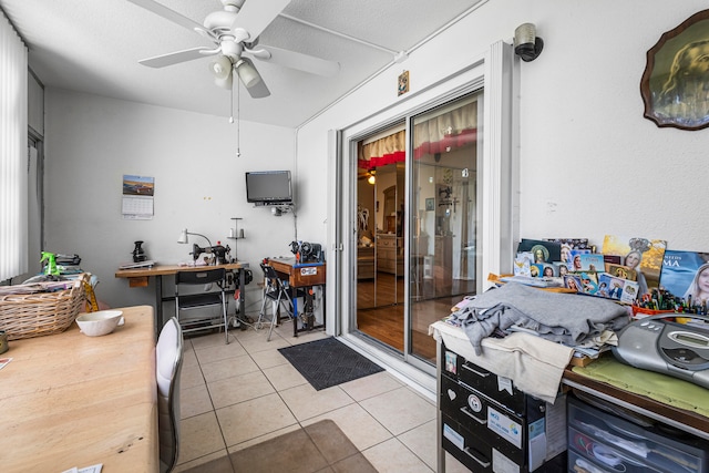 interior space featuring ceiling fan