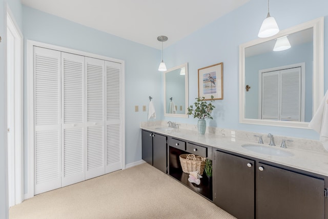 bathroom featuring dual bowl vanity