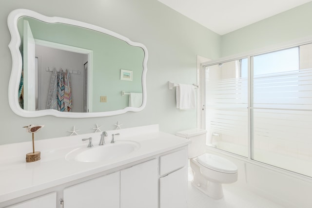 full bathroom featuring vanity, toilet, and enclosed tub / shower combo