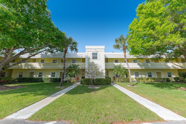 view of property featuring a front yard