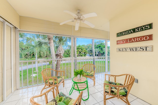 sunroom featuring ceiling fan