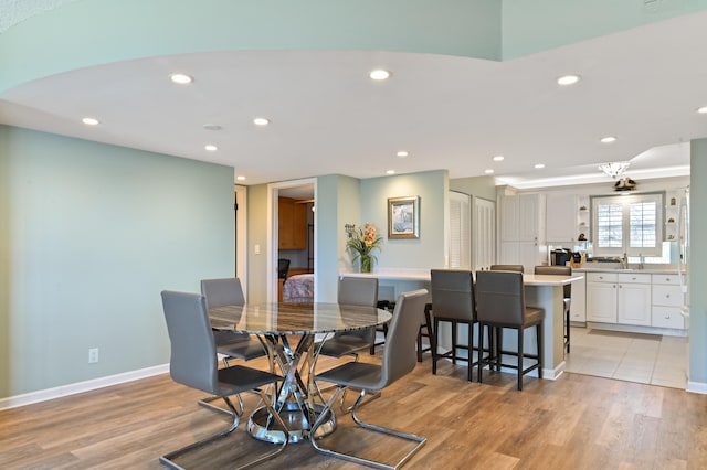 dining room with light wood-type flooring