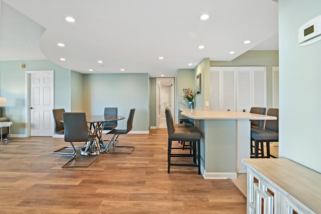 dining area with light hardwood / wood-style flooring