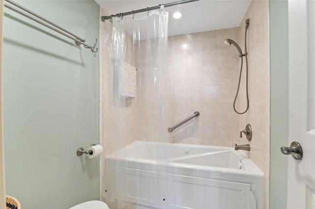 bathroom with shower / bathtub combination with curtain and toilet