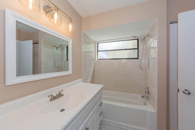 bathroom with tiled shower / bath combo and oversized vanity