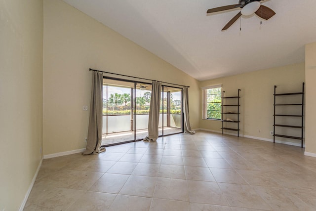 tiled empty room with vaulted ceiling and ceiling fan