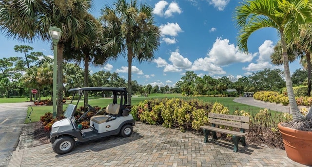 view of vehicle parking featuring a lawn