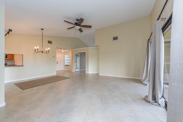 unfurnished living room with lofted ceiling, ceiling fan with notable chandelier, and light tile floors