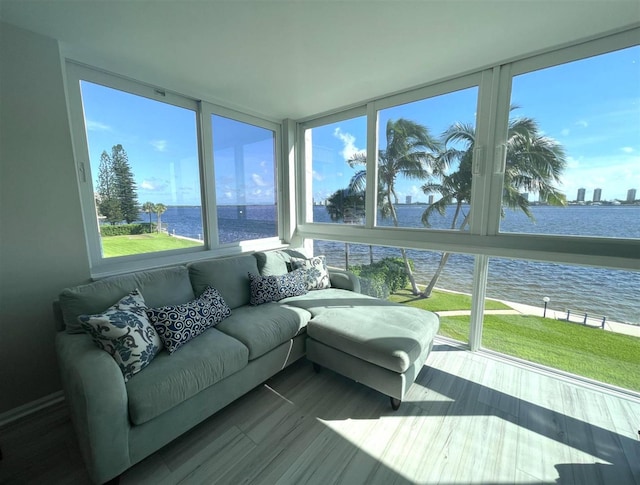 sunroom / solarium with a water view