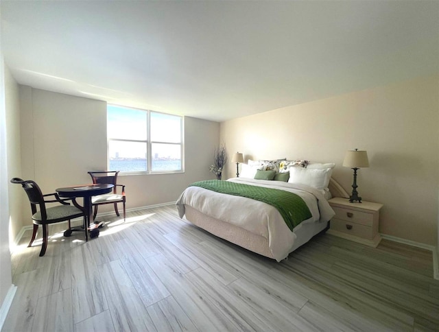 bedroom with light hardwood / wood-style flooring