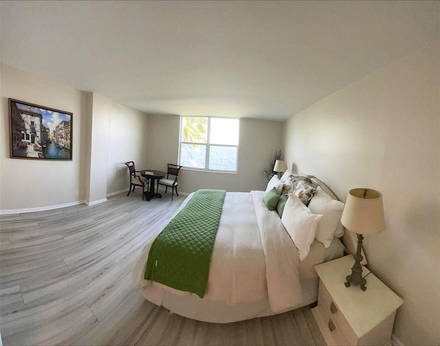 bedroom with light wood-type flooring