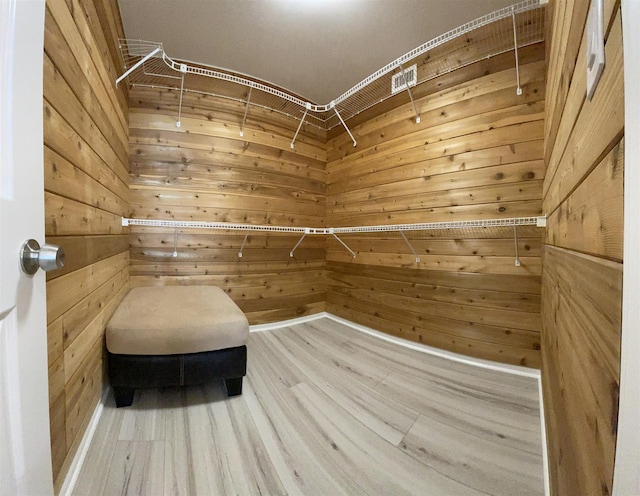 spacious closet featuring hardwood / wood-style flooring