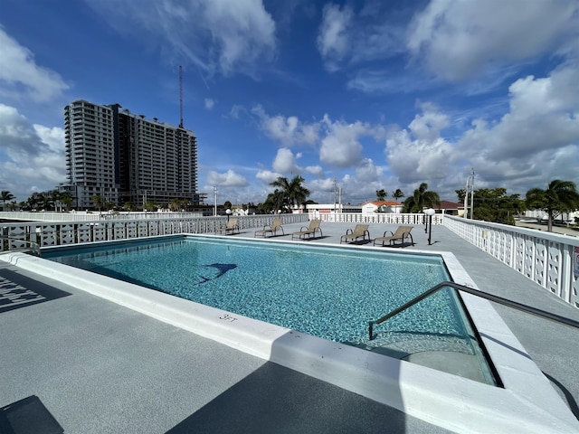 view of swimming pool featuring a patio