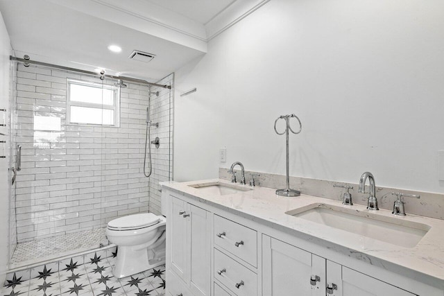 bathroom featuring dual bowl vanity, tile flooring, walk in shower, and toilet