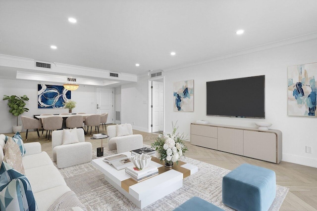 living room with crown molding and light parquet floors