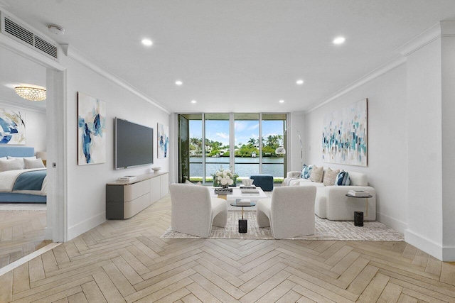 living room featuring a water view, ornamental molding, and light parquet flooring