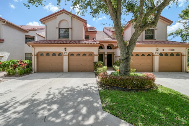 mediterranean / spanish-style house featuring a garage