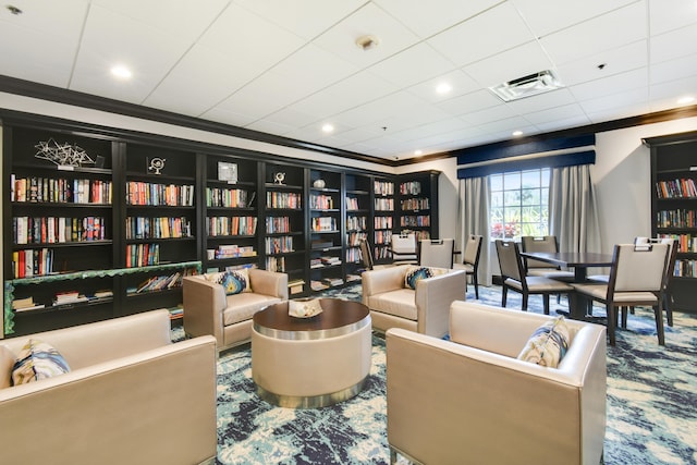 living area with crown molding