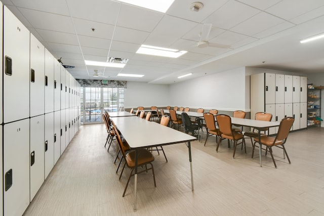 dining room with a drop ceiling