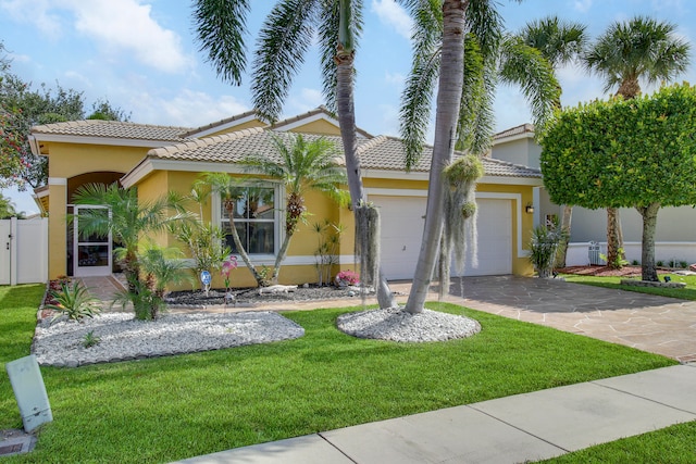 mediterranean / spanish house featuring a front lawn