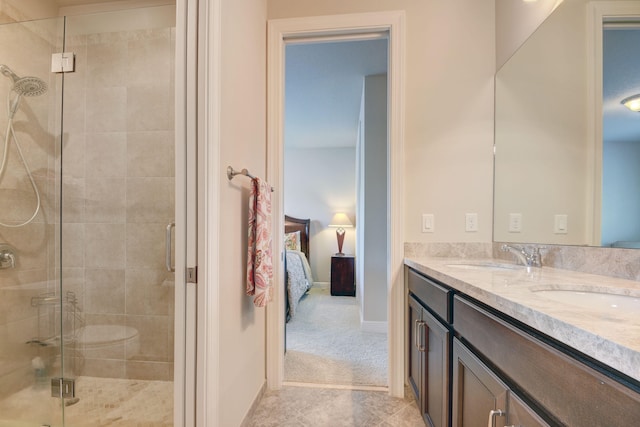 bathroom featuring vanity, tile patterned floors, and a shower with door