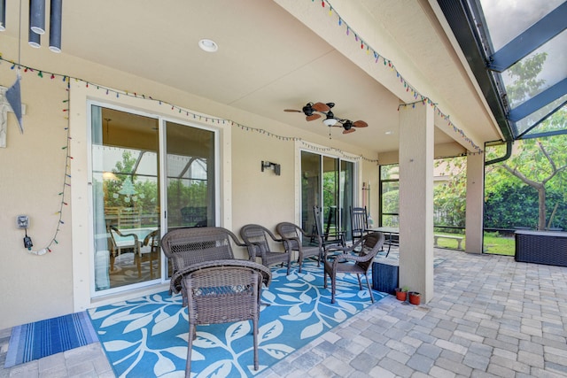 view of patio / terrace featuring ceiling fan