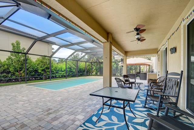 view of patio with a lanai and ceiling fan