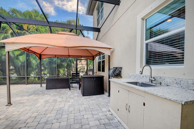 exterior space with sink and exterior kitchen